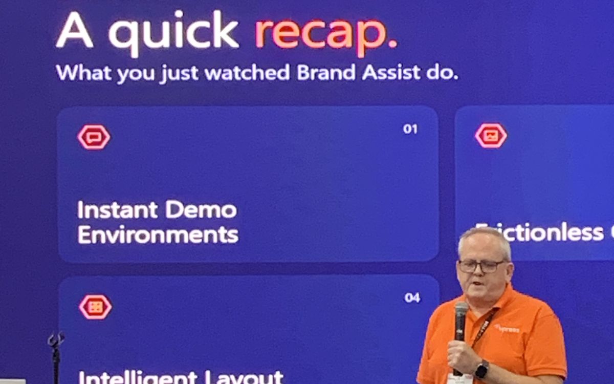 Kelvin Bell on stage recapping what Brand Assist does